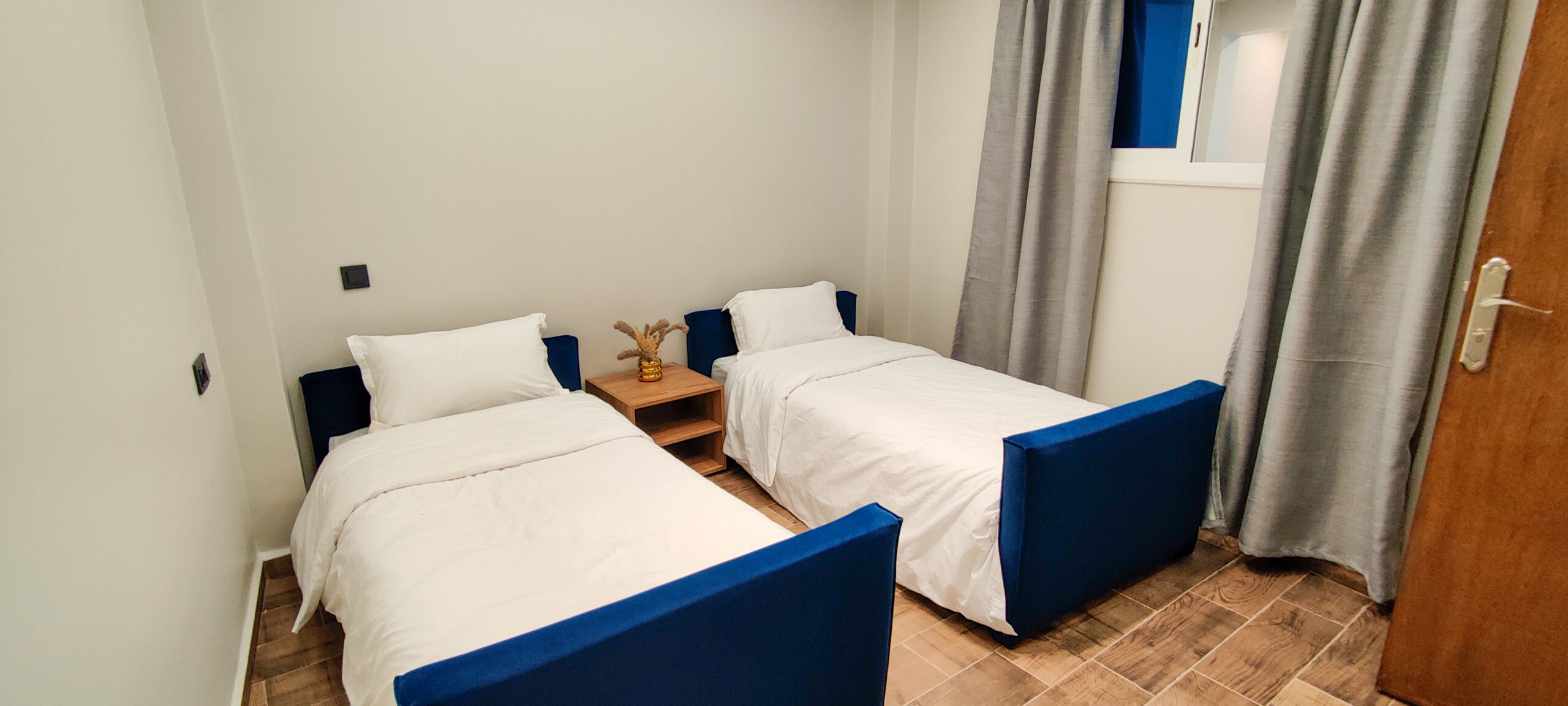 Private twin bedroom in Taghazout apartment surf camp