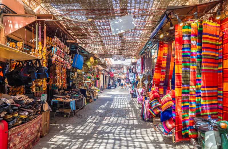 "A bazaar at Souk El Hed selling traditional Moroccan items such as crafts, rugs, pottery, and jewelry."