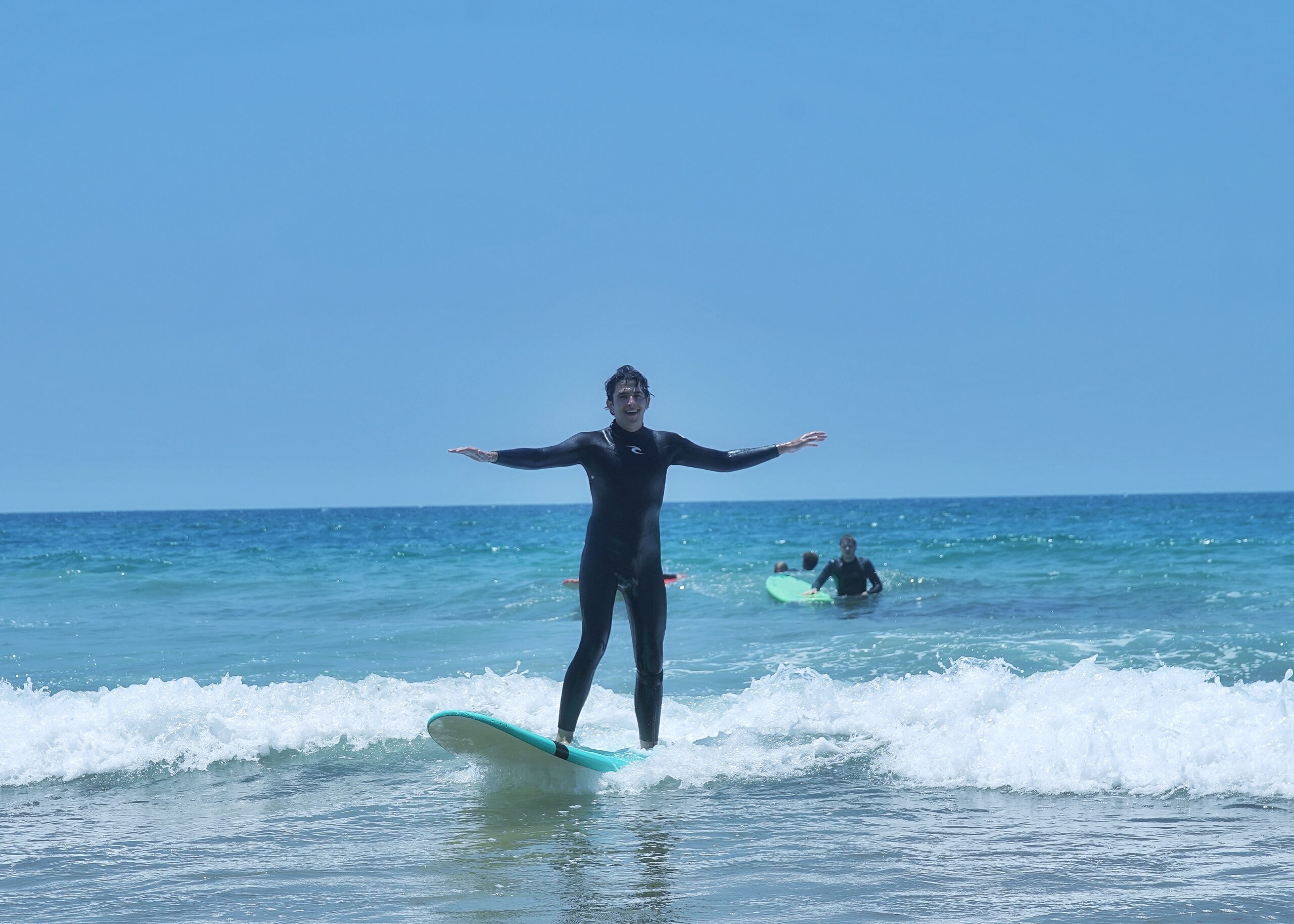 Surfer riding a wave in Taghazout, Morocco
